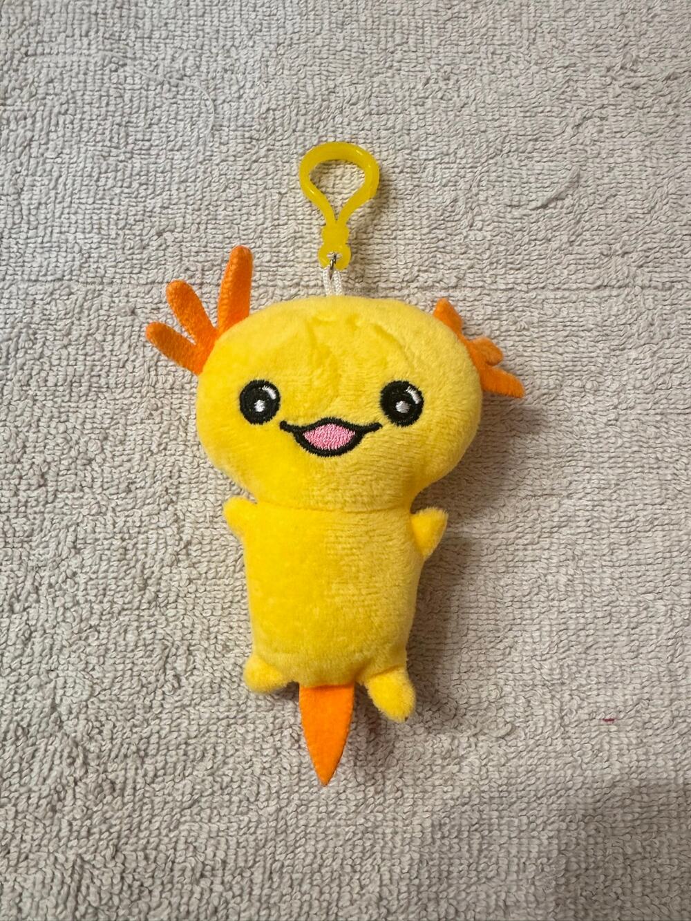 Yellow axolotl plush keychain bag charm with orange gills and tail